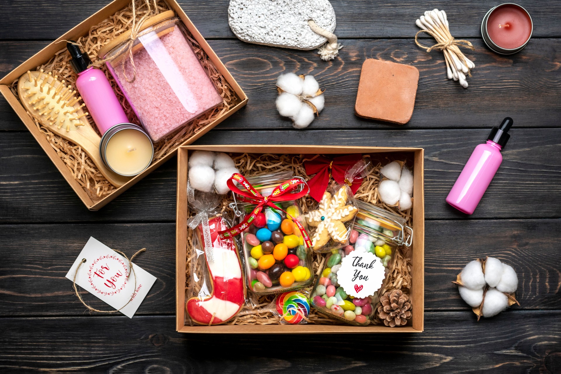 Set for care box Eco-friendly cosmetics Bath salt, comb, handmade soap, oil bottles, sponge, sweets on wooden background Gift for girlfriend, mother to celebrate Christmas concept Top view Flat lay