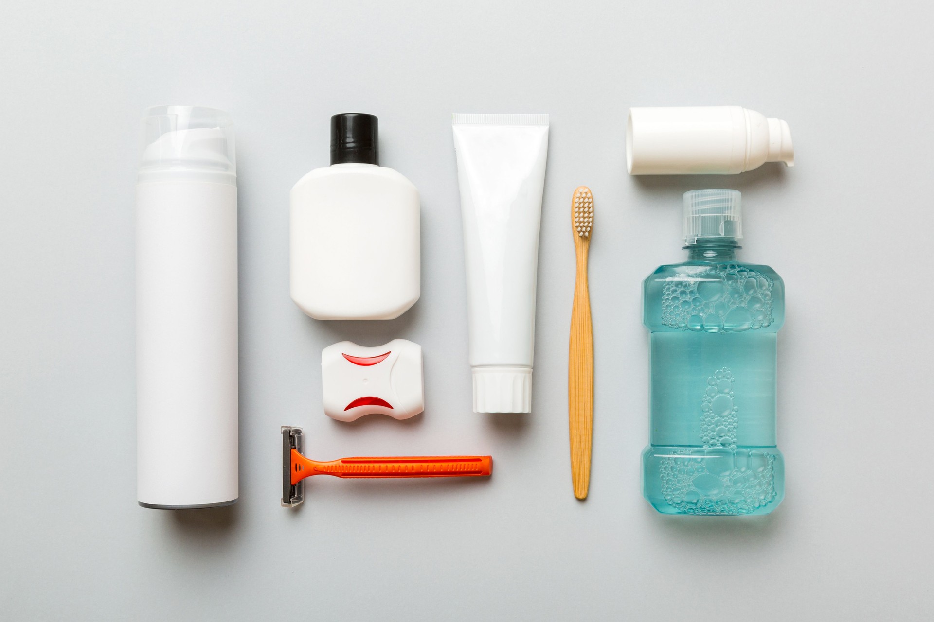 Mockup for bathing products top view flat lay, spa razor, toothpaste, soap, gel and other various accessories. Cosmetics for skin health. Bath Mockup for your logo